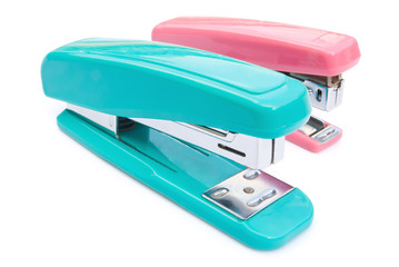 blue and pink staplers with clipping path