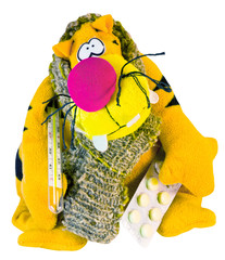 sick soft toy with a thermometer and pills