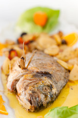 Fresh fish cooked with potatoes and tomatoes.