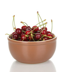 Ripe cherry berries in bowl isolated on white