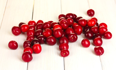 fresh cherry on white wooden table close-up