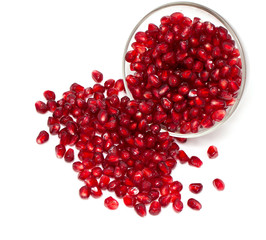 pomegranate in bowl isolated on white
