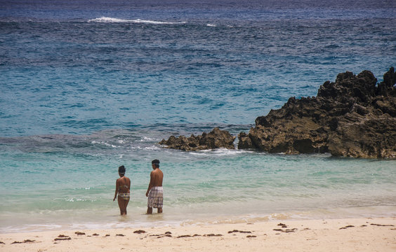 Couple On Pink Sand Beach Of Bermuda