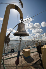 Fototapeta na wymiar Bronze bell on a tall ship