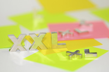 xxl sign, colored labels on the artistic shot.