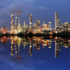 Naklejka premium Reflection of petrochemical plant at night