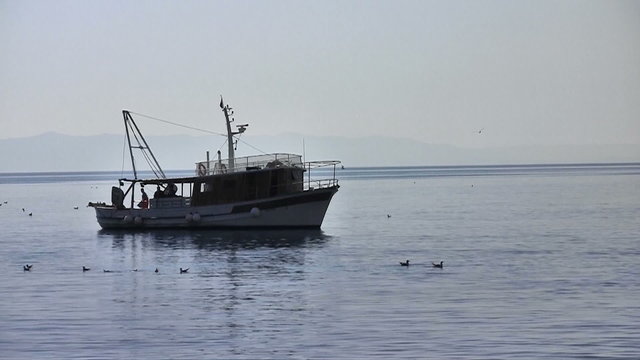 Fishermans working on fishing boat