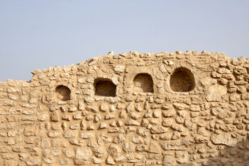 Shelves engraved in the walls of a room in Saar Village