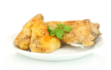 roasted chicken wings and leg with parsley in the plate