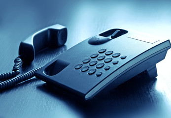 Modern call phone with cord in office