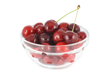 Red cherry in a glass bowl
