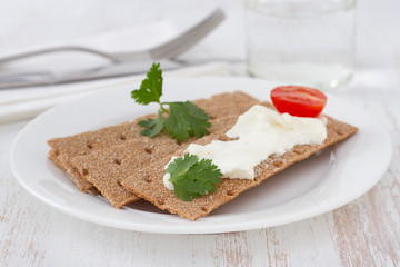 toasts with cream cheese and tomato