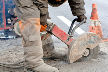Cutting asphalt road for repair
