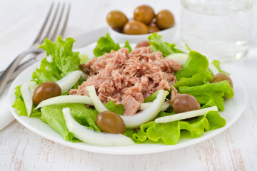 tuna salad with olives in white plate