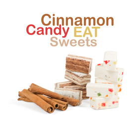 Sweets and cinnamon sticks isolated on white background