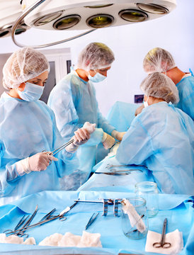 Surgeon at work in operating room.