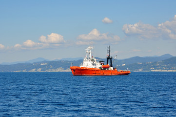 Orange rescue fire tow in the sea in the sunny summer day
