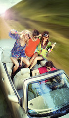 Young people having fun in cabriolet