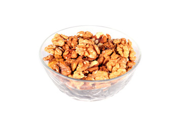 Walnuts in a plate on a white background