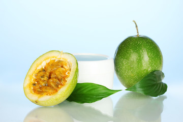 Naklejka na ściany i meble green passion fruit with cosmetical cream