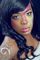 Beautiful young woman with colorful makeup, closeup shot