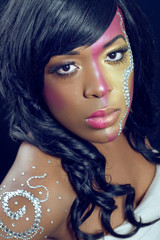 Fototapeta premium Beautiful young woman with colorful makeup, closeup shot