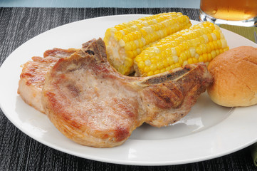 Grilled pork chops with corn on the cob