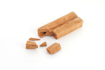 Piece of break brick on white floor.
