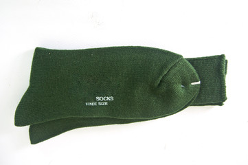 green female socks on white background