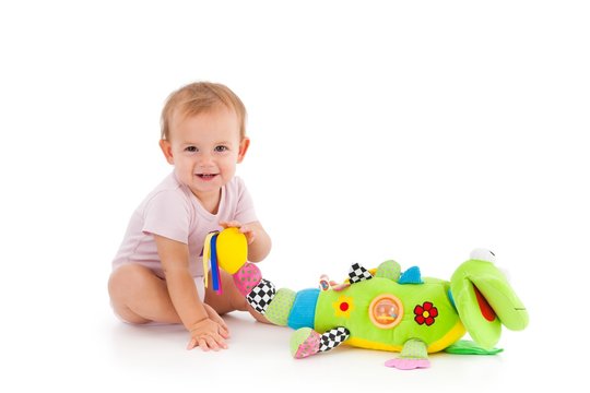 Happy toddler playing with toy
