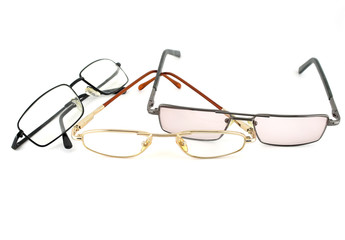 Three optical glasses over white