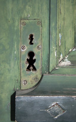 Strange keyholes on an old door