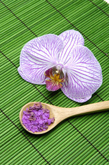 macro of orchid and bath salt in spoon flower on green mat