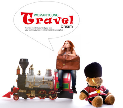 Girl with a suitcase on the toy train rides in England