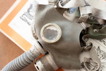 Gasmask on a book for children