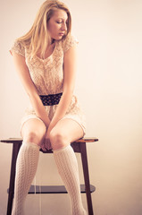Naklejka premium Young woman sitting on chair
