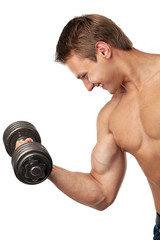 Fototapeta na wymiar Muscular young man lifting a dumbbell over white