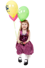 Obraz na płótnie Canvas Full isolated studio picture from a little girl with balloons