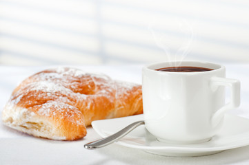 cup of coffee and croissant