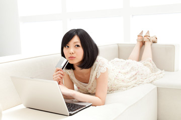 Obraz na płótnie Canvas Beautiful young woman using a laptop computer. Portrait of asian