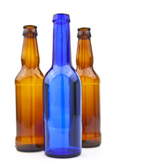 Empty glass bottles on white background