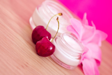 Obraz na płótnie Canvas beauty product with natural ingredients (cherries)