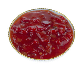 Dish of sweet pepper relish on white background