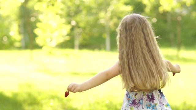 Girl with strawberry spinning