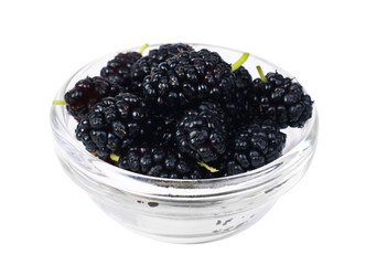 mulberry fruits in  glass isolated on white macro