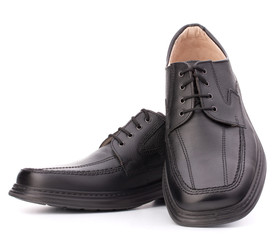 Black glossy man’s shoes with shoelaces