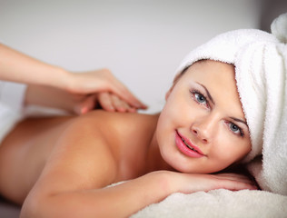 Relaxing massage for young beautiful woman in the spa salon