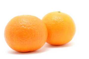 Couple of fresh oranges isolated over white