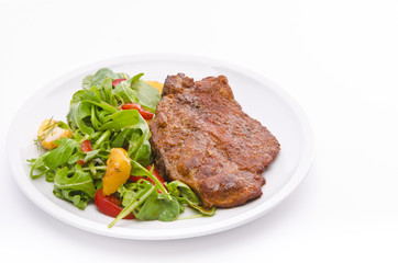 cervical chop with apricot-rocket salad