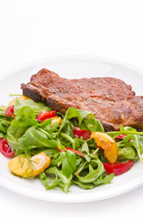 cervical chop with apricot-rocket salad